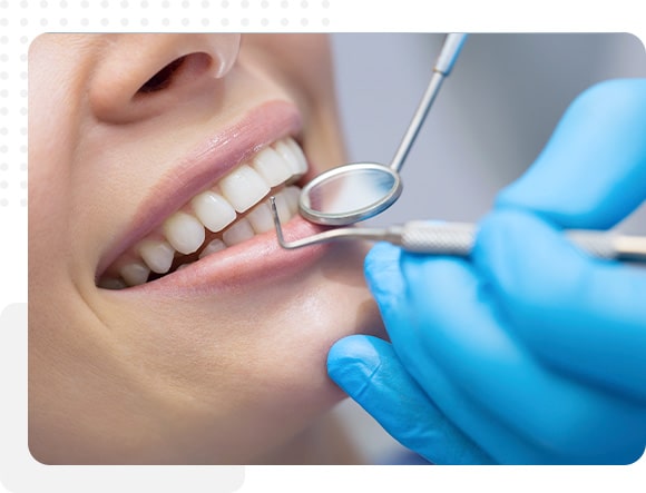 Dentist examining gums for periodontal health