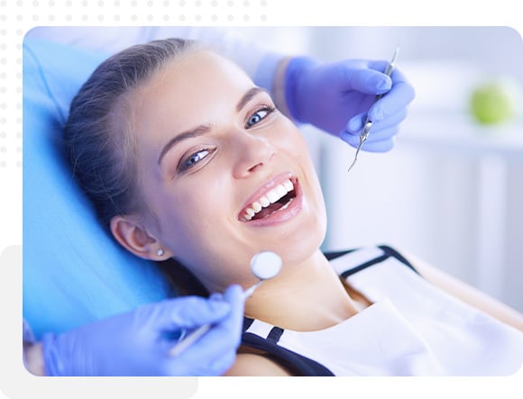 Dentist examining gums for periodontal health